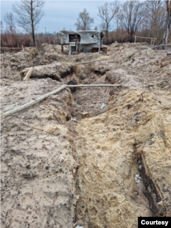 Trenches that Ukraine says Russian troops dug in radioactive soil near the Chernobyl nuclear power plant, damaged in a 1986 disaster, during a five-week occupation in February and March 2022. Photo taken on April 5, 2022. (Courtesy Evgen Kramarenko)