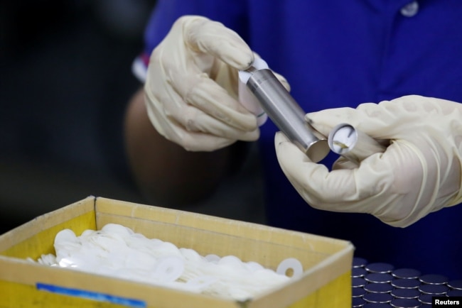 In this file photo, batteries for electric vehicles are shown being manufactured at a factory in Dongguan, China September 20, 2017. (REUTERS/Bobby Yip)