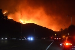 The Saddleridge fire advances into Granada Hills, California, Oct. 11, 2019.