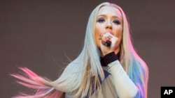 Amethyst Amelia Kelly, also known as Iggy Azalea, performs during Music Midtown 2014 at Piedmont Park in Atlanta, Sept. 19, 2014.