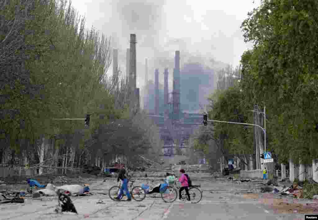 Smoke rises above a plant of Azovstal Iron and Steel Works in Mariupol