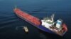 FILE: An aerial photograph taken on October 31, 2022 shows a cargo ship in the anchorage area of the southern entrance to the Bosphorus in Istanbul. On Friday, July 7, the International Maritime Organization said it would work to cut carbon emissions from global shipping.