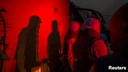 United Nations peacekeepers at the MINUSMA base take cover after a mortar attack in Kidal, Mali, June 8, 2017.