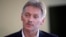President Vladimir Putin's spokesman Dmitry Peskov speaks with The Associated Press in Moscow, April 6, 2017. Peskov, speaking days after a suspected chemical weapons attack, says Russia's support for Syrian President Bashar Assad is not unconditional.