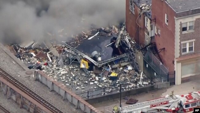 In this screen grab from video provided by WPVI-TV/6ABC, smoke rises from an explosion at the R.M. Palmer Co. plant in West Reading, Pennsylvania, March 24, 2023.