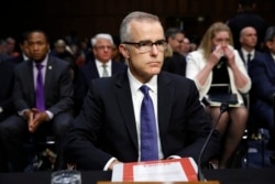 Acting FBI Director Andrew McCabe sits with a folder marked "Secret" in front of him while testifying on Capitol Hill in Washington, May 11, 2017.