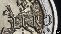 The map of Europe is featured on the face of a two Euro coin seen in this photo illustration taken in Rome, December 3, 2011.