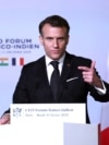 French President Emmanuel Macron addresses a forum on the sidelines of the Artificial Intelligence Action Summit in Paris, Feb. 11, 2025.