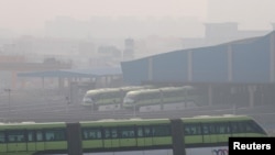 FILE - People commute in a Mumbai Monorail on a smoggy morning in Mumbai, India, Jan. 7, 2021.