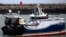 FILE - A French fishing boat blocks the entrance to the port of Calais, northern France, Nov. 26, 2021.