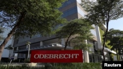 FILE - The corporate logo of the Odebrecht SA construction conglomerate is seen at its headquarters in Sao Paulo, Brazil, July 29, 2019.