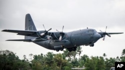 FILE - A RNZAF C-130 Hercules takes off from Nausori Airport, having just delivered aid and cargo in support of the relief effort following Tropical Cyclone Winston in Fiji on Feb. 27, 2016.