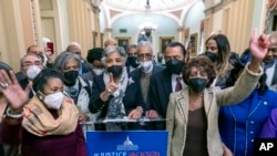 Members of the Congressional Black Caucus, with Rep. Sheila Jackson Lee, D-Tex., left, Rep. Joyce Beatty, D-Ohio, center, and Rep. Maxine Waters, D-Calif., right, speak to reporters at the Capitol in Washington, Thursday, April 7, 2022. (AP Photo/J. Scott Applewhite)