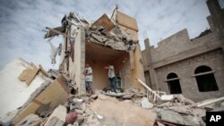 Boys stand on the rubble of a house destroyed by Saudi-led airstrikes in Sanaa, Yemen. (File)