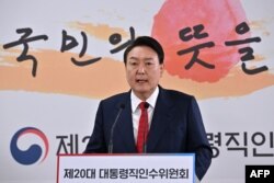 FILE - South Korea's President-elect Yoon Suk-yeol speaks during a press conference in Seoul, March 20, 2022.