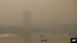 FILE - Morning smog envelops the skyline in Mumbai, India, Oct. 20, 2017.