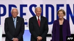 Senadores demócratas Bernie Sanders, Joe Biden y Elizabeth Warren. AFP.