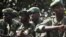Congolese army soldiers sit in a military truck in Minova, 45 kilometers west of Goma, DRC, November 26, 2012. 