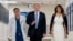 President Donald Trump, center, accompanied by and first lady Melania Trump, right, and Dr. Igor Nichiporenko, left, speak to reporters while visiting with medical staff at Broward Health North in Pompano Beach, Fla., Feb. 16, 2018.