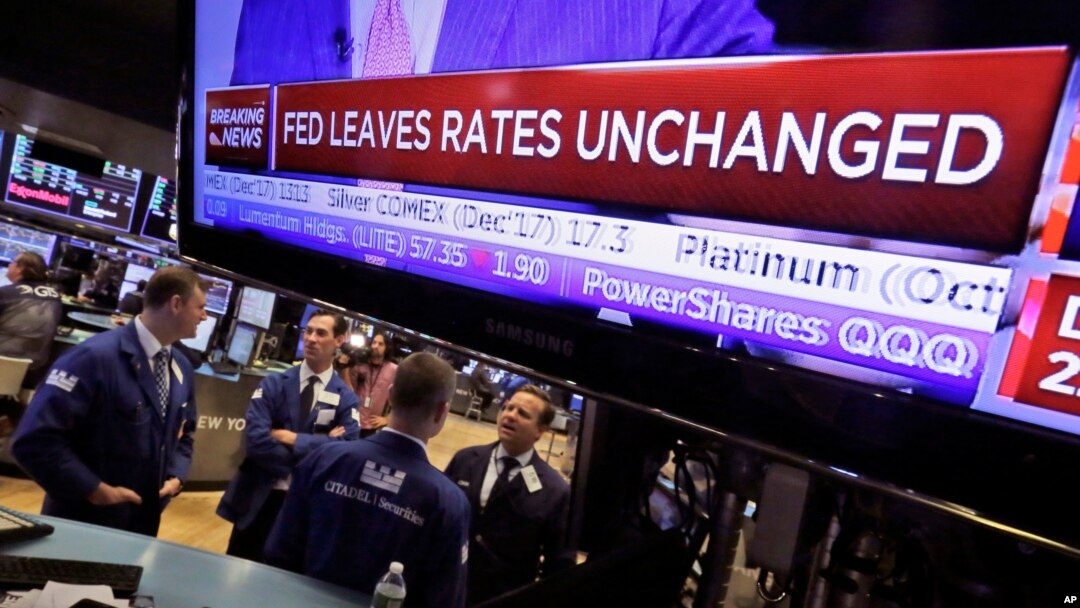 The rate decision of the U.S. Federal Reserve appears on a television screen, on the floor of the New York Stock Exchange, in New York City, Sept. 20, 2017.