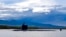 FILE - In this photo provided by U.S. Navy, a submarine departs Joint Base Pearl Harbor-Hickam, Sept. 1, 2021. 