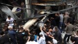 این عکس منتشر شده توسط خبرگزاری رسمی سوریه، سانا، محل انفجار يک اتومبيل در دمشق را نشان می دهد. ۵ نوامبر، ۲۰۱۲.