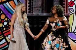 Carrie Underwood, left, and CeCe Winans perform at the 56th annual Academy of Country Music Awards on 17, 2021, at the Grand Ole Opry in Nashville, Tenn.