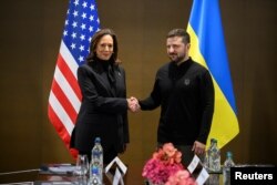 U.S. Vice President Kamala Harris shakes hands with Ukrainian President Volodymyr Zelenskyy as they meet for a bilateral talk during the Ukraine Peace Summit near Lucerne, Switzerland, on June 15, 2024.