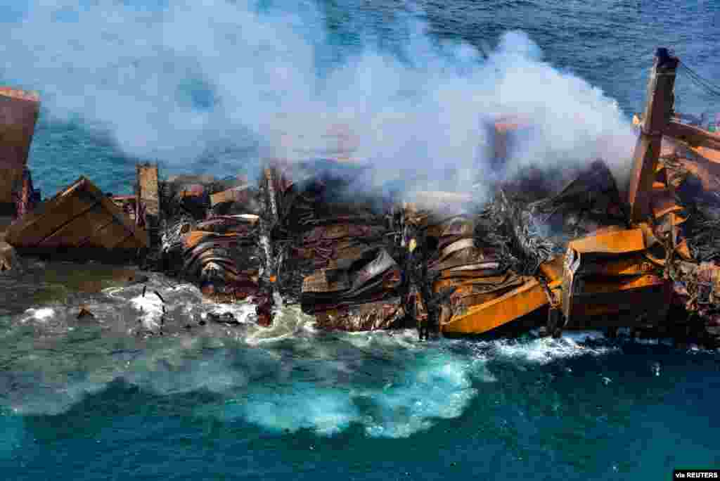 Smoke rises from a fire onboard the MV X-Press Pearl vessel as it sinks while being towed into deep sea off the Colombo Harbor in Sri Lanka. (Credit: Sri Lank Air Force)