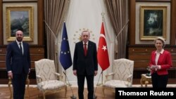 Turkish President Erdogan meets with European Council President Michel and European Commission President von der Leyen in Ankara as TV images showed two chairs had been laid out in front of EU and the Turkish flags for the three leaders, April 7, 2021. 