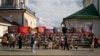 People stand near a memorial to Russian mercenary chief Yevgeny Prigozhin, who died in a plane crash last year, in Moscow on July 29, 2024. Prigozhin's Wagner unit suffered heavy losses in an attack in Mali last week.