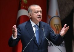 FILE - Turkey's President Recep Tayyip Erdogan addresses his ruling party members, in Ankara, Turkey, July 26, 2019.