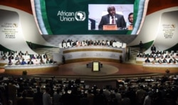 FILE - Chairperson of the African Union Commission Moussa Faki Mahamat delivers a speech during the African Union (AU) summit at the Palais des Congres in Niamey, Niger, July 7, 2019.