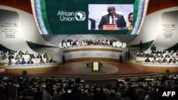 FILE - Chairperson of the African Union Commission Moussa Faki Mahamat delivers a speech during the African Union (AU) summit at the Palais des Congres in Niamey, Niger, July 7, 2019.