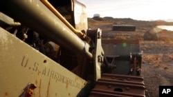 In this file photo dated Aug. 16, 2005, an abandoned US Air Force vehicle is seen outside the eastern Greenland settlement of Kulusuk where there used to be a U.S. Air Force base as part of an early warning radar system. 