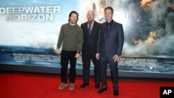 Director Peter Berg, from right, oil rig manager Mike Williams and actor Mark Wahlberg arrive at the premiere of the film 'Deepwater Horizon' in London, Sept. 26, 2016.