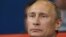 Russian President Vladmir Putin watches the judo competition at the 2012 Summer Olympics, London, Aug. 2, 2012.