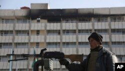 An Afghan police officer stands guard in front of the Intercontinental Hotel in Kabul, Afghanistan. (File)