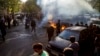 FILE - In this photo taken by an individual not employed by the Associated Press and obtained by the AP outside Iran, Iranians protests the death of 22-year-old Mahsa Amini, Tehran, Oct. 27, 2022. 