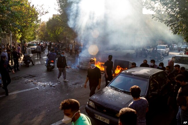 FILE - In this photo taken by an individual not employed by the Associated Press and obtained by the AP outside Iran, Iranians protest the death of 22-year-old Mahsa Amini, Tehran, Oct. 27, 2022.