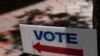 FILE - A "VOTE" sign stands outside an early voting location, Oct. 31, 2022, in Miami. U.S. officials charged with helping to secure the upcoming midterm elections fear the most dangerous and most likely threats may be difficult or impossible to detect in advance.