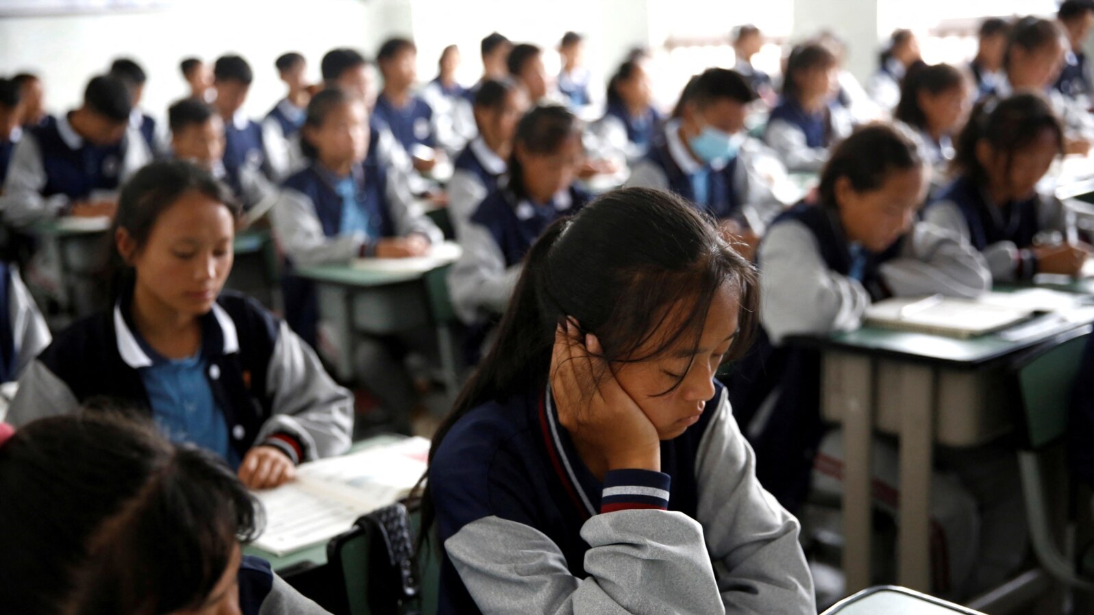 FILE - Students attend a class at the Wenchang Middle School in Yuexi county, during a government-organized media tour in Liangshan Yi Autonomous Prefecture, Sichuan province, China, Sept. 11, 2020. 