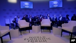 Attendees wait for the start of a session at the annual meeting of the World Economic Forum in Davos, Switzerland, Jan. 22, 2019. 