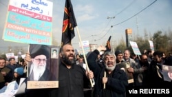 Demonstrators in Tehran protest the assassination of the Iranian Major-General Qassem Soleimani, head of the elite Quds Force, and Iraqi militia commander Abu Mahdi al-Muhandis, who were killed in a US air strike in Baghdad airport, Jan. 3, 2020.