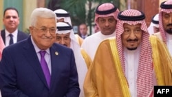 A handout picture provided by the Saudi Royal Palace Oct. 16, 2019, shows King Salman bin Abdulaziz (R) receiving Palestinian President Mahmoud Abbas (L), in the Saudi capital Riyadh. 