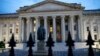 FILE - The U.S. Treasury Department building is seen at dusk, June 6, 2019, in Washington. 