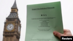 FILE - The passage of the Brexit Article 50 bill, shown in front of the Houses of Parliament in London, Jan. 26, 2017, starts Britain's process of leaving the European Union.