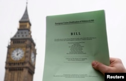 FILE - The passage of the Brexit Article 50 bill, shown in front of the Houses of Parliament in London, Jan. 26, 2017, starts Great Britain's process of leaving the European Union.