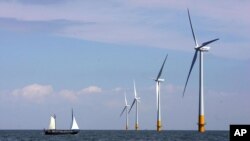 FILE - A wind farm off the coast of southeastern England, July 11, 2006. Britain's Conservative government reversed a ban on building new onshore windfarms on Dec. 7, 2022, the same day it approved the United Kingdom's first new coal mine in three decades.