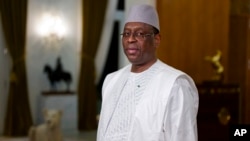 FILE —Senegal President Macky Sall poses before an interview with The Associated Press at the presidential palace in Dakar, Senegal, February 2024.